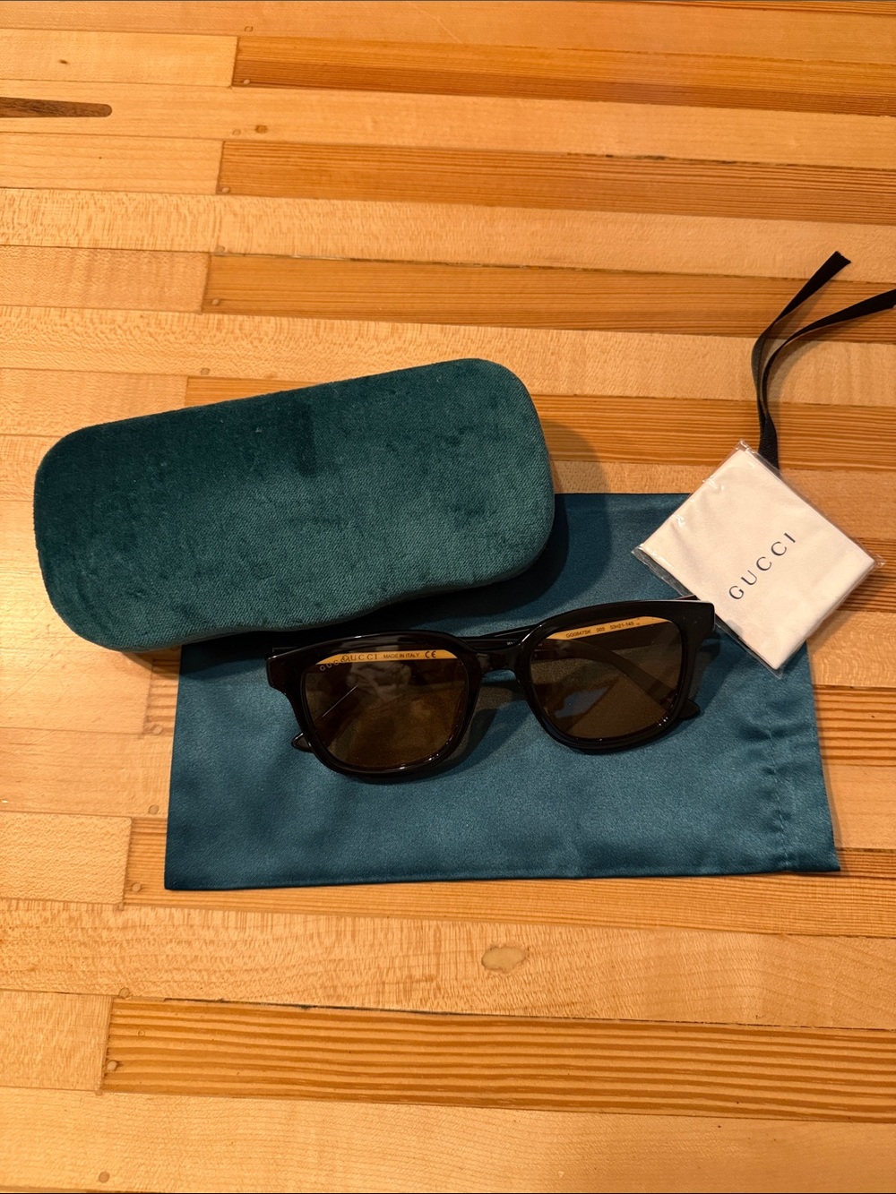 Gucci Black Frame Sunglasses with Light Brown Lenses